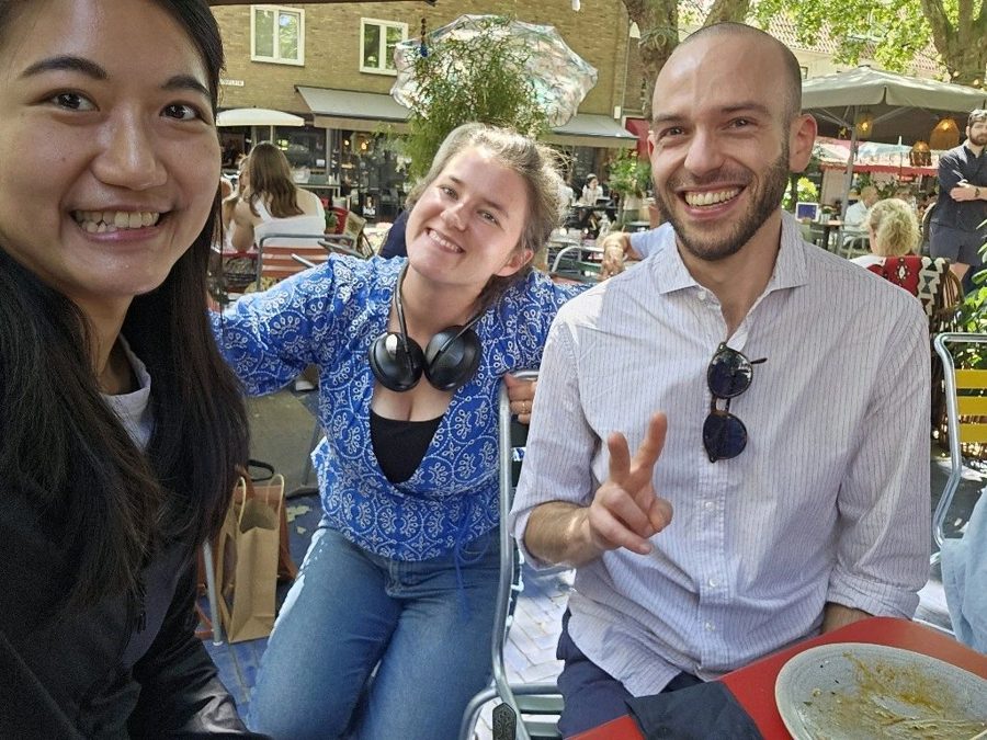 Researchers smiling over lunch
